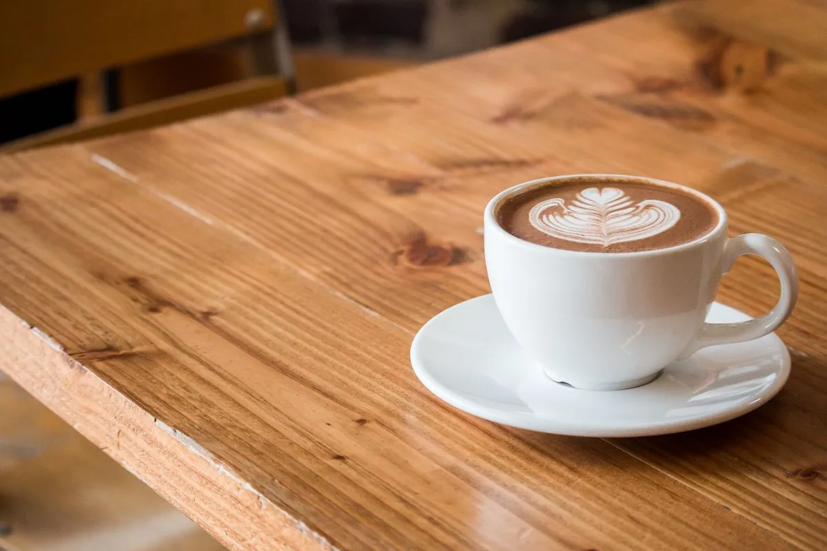 Flat white on a wooden table
