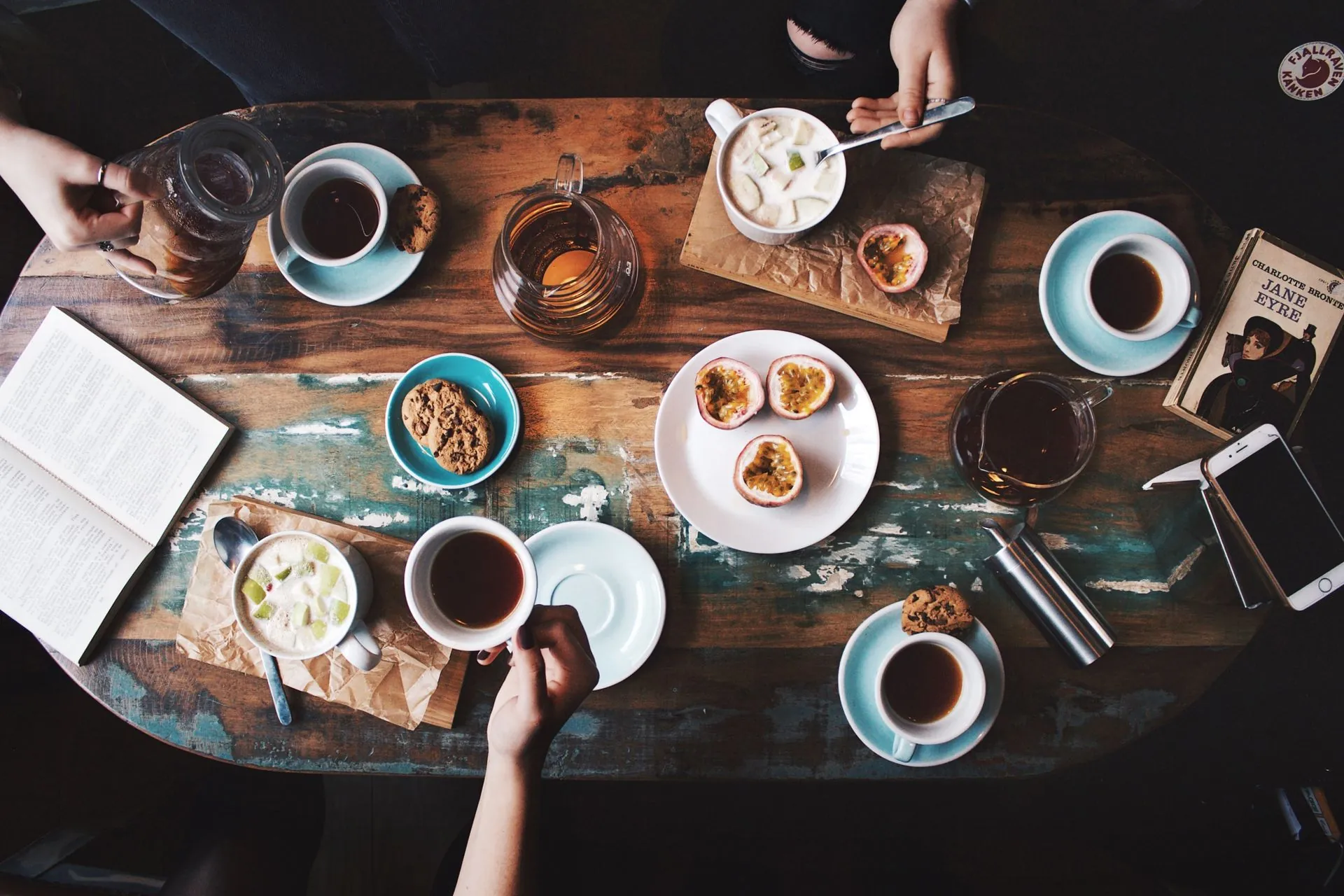 Friends sharing coffee and pastries